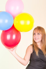 Fototapeta na wymiar happy cute woman with balloons