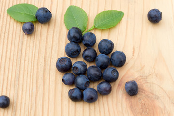 Fresh blueberries  on a wooden table.