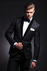 fashion man posing in tuxedo