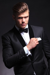 business man holds his pocket handkerchief