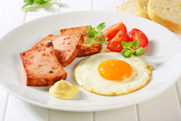 Pan-fried Leberkase with sunny side up fried egg