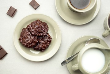 Chocolate cookies with coffee and milk