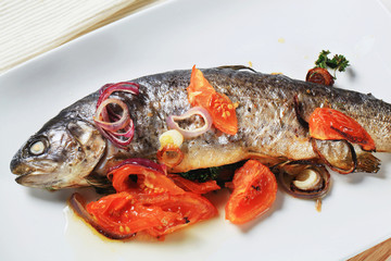 Baked trout with tomatoes and onion