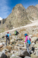 Fototapeta premium Hikier is climbing mountain in Caucasus mountains in Bezengi reg