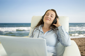 listening to chill out music on the beach