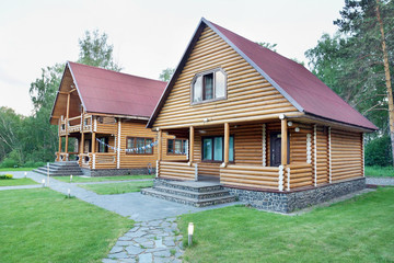 Two Wooden Houses Made of Logs