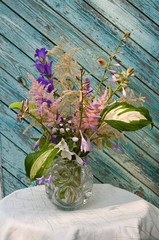 bouquet on a ragged old wooden wall background