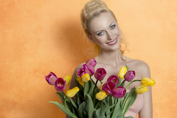 Blonde woman with colourful bouquet