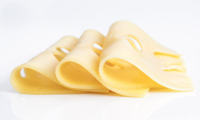 several Leerdammer cheese slices on white base © Jultud