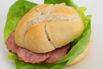 Sandwich with smoked sausage and lettuce