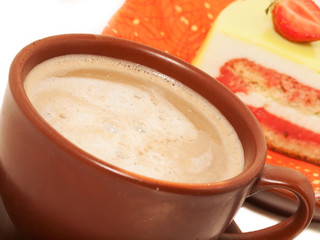 Cup of cappuccino coffee with cake