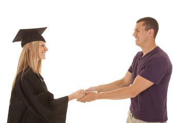 man giving woman diploma