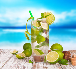 Summer drink with blur beach on background