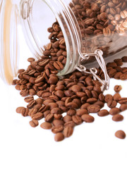 Heap of coffee beans from jar
