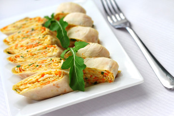 Rolls of Armenian lavash with onions, carrots and cheese
