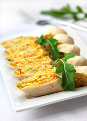 Rolls of Armenian lavash with onions, carrots and cheese
