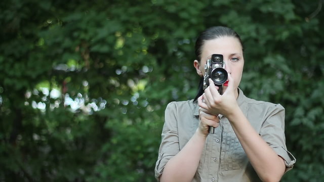 Woman with old movie camera