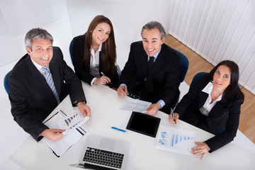 Portrait Of Businesspeople Working