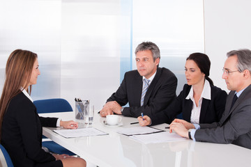 Businesspeople Interviewing Woman