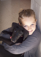 Child with puppy