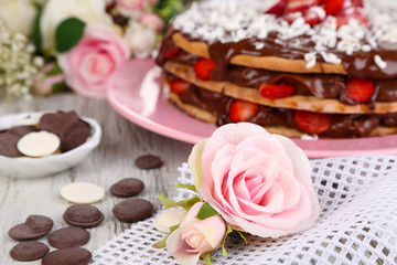 Fototapeta na wymiar Chocolate cake on wooden table close-up