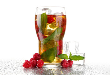Iced tea with raspberries and mint isolated on white