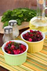 Beet salad in bowls on table close-up