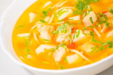 Fish soup with vegetables and pasta