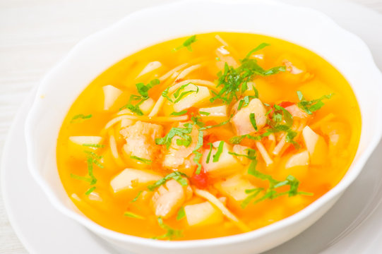 Fish soup with vegetables and pasta