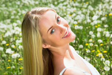 Woman among dandelions