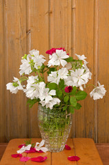 bouquet of white flowers on the wooden wall background