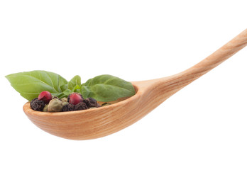 Pepper seasoning  mix in wooden spoon isolated on white backgrou