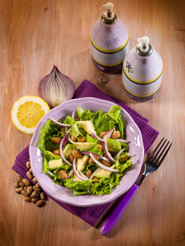 salad with avocado lettuce beans and onions