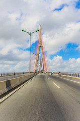 Fototapeta premium The top of the cable-stayed bridge in the cloud blue sky
