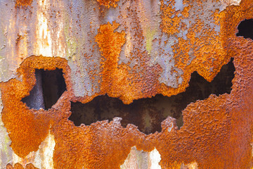 pattern of rusty metal of an old chimney