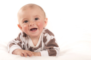 Portrait of sitting little baby boy on a white background