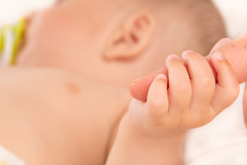 Baby and mother hands