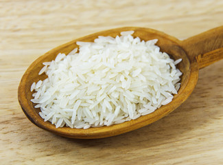 Jasmine rice on wooden spoon
