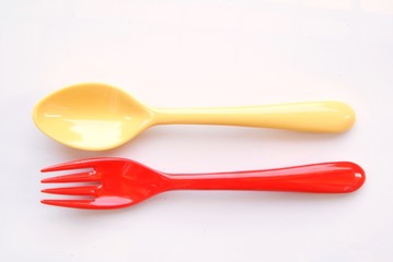 yellow spoon and red fork
