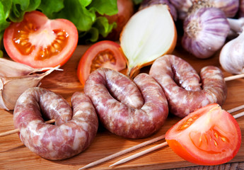 Sausage, garlic, tomatoes, lettuce, onions