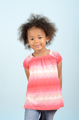 Three quarter length portrait of young mixed race girl