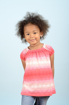 Three Quarter Length Portrait Of Young Mixed Race Girl