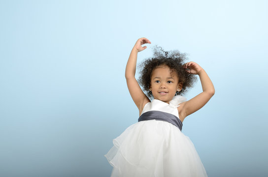 Mixed Race Girl Holding Up Her Arms