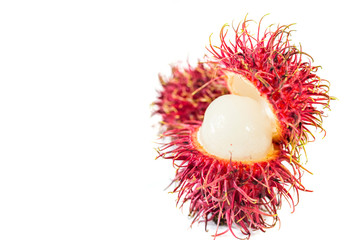 Rambutan and mango fruits in a basket over white background
