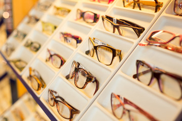 Eyeglasses, shades and sunglasses in optometrist's shop