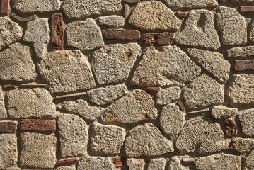 Masonry sandstone wall irregularly shaped stones as background