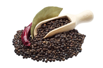 Black pepper in spoon and bay leaf