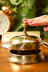  woman at the reception of a hotel checking in