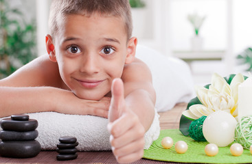 young boy ready to treatment in spa salon