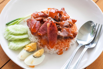 serving of rice with roasted pork on top